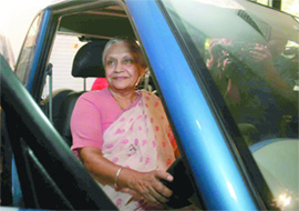 Chief Minister Sheila Dikshit at the driving seat of the Reva car in New Delhi on Wednesday.