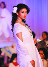 A model presents a creation of designers Meera and Muzaffer Ali's Kotware studio collection during a fashion show 'Romance of cotton' in New Delhi on Tuesday. 