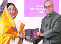 The first electronic passport being presented to President Pratibha Patil by external affairs minister Pranab Mukherjee in New Delhi on Wednesday.
