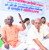 BJP leader K.N. Govindacharya (L) sits in a dharna in support of Prof G.D. Agarwal on his Save Ganga campaign in New Delhi on Tuesday.