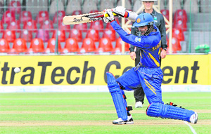 Kumar Sangakkara hits a stroke during a match between Bangladesh and Sri Lanka for the Asia Cup at Gaddafi Stadium in Lahore on Wednesday.