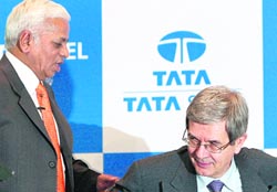 Corus CEO Philippe Varin (R) makes way for Tata Steel managing director B. Muthuraman at a press conference in Mumbai on Thursday. 