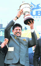 Kapil Dev holds up the Prudential Trophy at Lords in London on Wednesday.