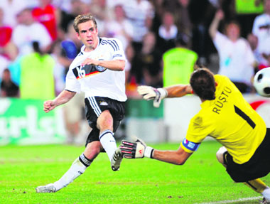 German defender Philipp Lahm (L) scores the third goal past Turkish goalkeeper Rustu Recber during the Euro 2008 championships semifinal match on Wednesday at St Jakob-Park stadium in Basel, Switzerland.