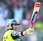 Shoaib Malik raises his bat as he scored a century during the Asia Cup match between Pakistan and India at the National Cricket Stadium in Karachi on Thursday.