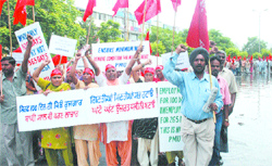 Members of the Pendu Mazdoor Union hold a protest march against the Punjab government in Jalandhar