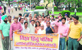 Activists of Hindu organisations hold a protest at the mini secretariat in Ludhiana on Friday.