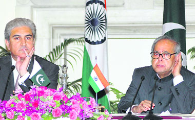 Pakistan foreign minister Makhdoom Shah Mahmood Qureshi with external affairs minister Pranab Mukherjee during the joint press conference after a meeting at Hyderabad House in New Delhi on Friday.