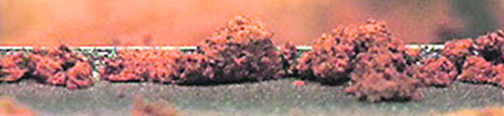 This image provided by NASA shows a microscopic view of fine-grained material as seen by the robotic arm camera aboard NASA's Phoenix Mars Lander.