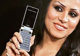 A model displays P'9521, the first Porsche Design mobile phone, during its India launch in Mumbai