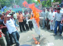 Bajrang Dal activists burn effigies in Jalandhar on Saturday.