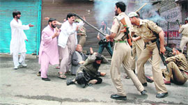 olicemen canecharge chairman of the Jammu and Kashmir Liberation Front (JKLF) Mohammad Yasin Malik and other protesters in Srinagar on Saturday.