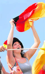 A German supporter cheers on the eve of the Euro 2008 final on Saturday in front the Ernst-Happel stadium in Vienna, Austria.