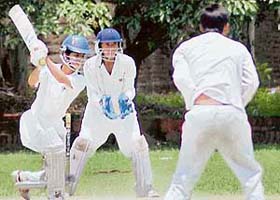 A batsman of Aresson XI hits a shot in the semifinal match against ERCA in the All-India Challenger Trophy Under-16 Cricket Tournament on the St Johns ground
