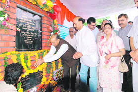 Chief Minister Prem Kumar Dhumal lays the foundation stone of a drinking water scheme for the Changar area in the Thural assembly constituency of Kangra district on Sunday.