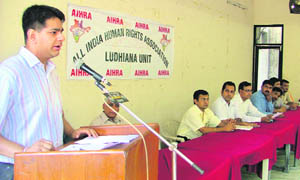 Members of the All-India Human Rights Association (AHIRA) address a press conference in Ludhiana on Sunday. 