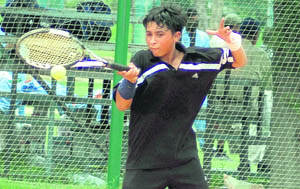 A player in action during a match of the AITA Total Tennis Talent Series on PAU campus, Ludhiana.
