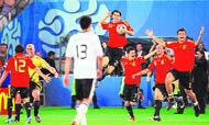 Spanish forward Fernando Torres (L) scores the opening goal past German goalkeeper Jens Lehmann during the final against Germany at Ernst-Happel stadium in Vienna, Austria on Sunday. Spain ended their 44-year wait for a major international title with a 1-0 victory over Germany at the Euro 2008 final. ( Inset) Spanish midfielder Santiago Cazorla (front L) and goalkeeper Jose Manuel Reina (back, L) celebrate as midfielder Ruben de La Red (back, 4thR), forwards David Villa (back, 3rdR) and Sergio Garcia (back, 2ndR) and defender Raul Albiol (R) jubilate past German midfielder Michael Ballack (C) after winning the final.