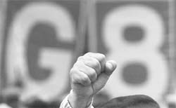 An anti-G8 protester raises his fist during a rally against next month's G8 summit in Hokkaido, northern Japan, on Sunday.