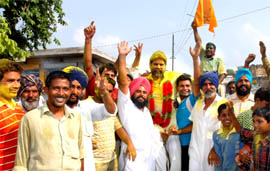SAD activists celebrate the victory of a party candidate, Inderpal, at Bhucho Mandi, in the municipal council elections in Bathinda district on Monday.