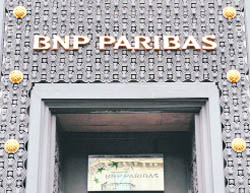 This file shows the logo of one of the buildings of France's top bank BNP Paribas headquarters in Paris. Shares of BNP Paribas fell sharply on Monday on a report from British bank HSBC suggesting that it might need a capital increase to offset losses arising from a global credit crisis. BNP, which has emerged from a global credit squeeze in better shape than most of its French rivals, has suffered a 23.3 per cent fall in its share price since the start of the year.