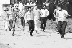 People throw stones at ward number 24; (right) two persons that were hurt in the stone-pelting incidence in Rajpura on Monday. 