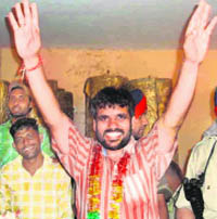 Narinder Kumar Sharma, independent candidae of ward no. 6, in a jubilant mood after winning the municipal council election at Zirakpur on Monday.
