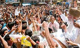 Chairman of the hardline faction of the All-Party Hurriyat Conference Syed Ali Shah Geelani addressing Kashmiri Muslim protesters during a demonstration near Jama Masjid in Srinagar on Monday.