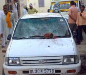 A vehicle damaged due to stone pelting by Congress activists on a SAD procession at Phul in Bathinda on Tuesday.