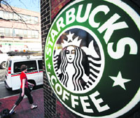 A woman walks past a Starbucks store in Somerville, Massachusetts, in this file photo.