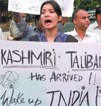 Kashmiri Hindu groups including Roots In Kashmir, Panun Kashmir, All India Kashmiri Samaj, Kashmiri Samiti Delhi protest against the firing on Kashmiri Hindus and Dogras in Jammu and the cancellation of land to Amarnath Shrine Board in New Delhi on Wednesday. 