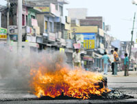 Violating curfew restrictions, people protesting in Vijaypur of Samba district on Wednesday.