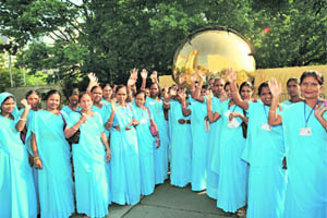 Over 30 scavenger women from India wave outside the United Nations in New York on Tuesday.