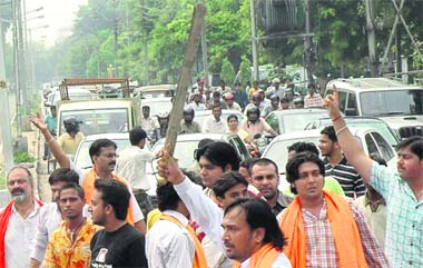Activists of the BJP block traffic near the Sector 22-21 traffic junction on Thursday
