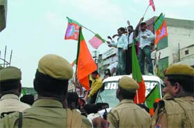 Bharatiya Janata Party (BJP) activists block traffic at Vikas Marg