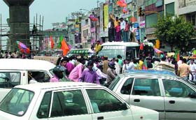 Bharatiya Janata Party (BJP) activists block traffic at Vikas Marg