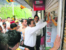 VHP members force the closure of shops on The Mall at Shimla during the all-India bandh on Thursday.