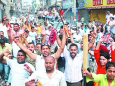 Activists of the Bharatiya Janata Party and various other Hindu organisations brandish swords during a protest observing Bharat Bandh in Jalandhar 