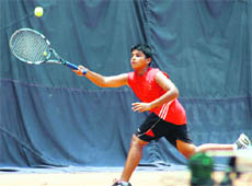  A player in action during a match of the AITA Total Tennis Talent Series on PAU campus in Ludhiana on Thursday.
