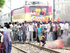 BJP and VHP activists stop a passenger train at Gyaspura