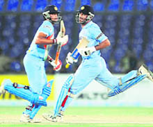 Mahendra Singh Dhoni (R) and Suresh Raina run between the wickets during the Super League Asia Cup match between India and Sri Lanka at National stadium in Karachi on Thursday. India beat Sri Lanka by six wickets in the Super League match to reach the final of the Asia Cup.