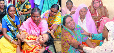 Relatives console mothers of Neelam and Anjali who died in a truck accident in New Delhi on Friday.