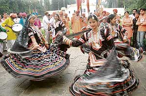 Girls perform at mango mela in Pinjore on Saturday. 