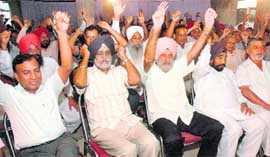 Members of the Joint Action Committee along with residents of Sector 50, 51 and 63 during a rally held in Sector 50 in Chandigarh on Saturday.