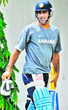 Indian captain Mahendra Singh Dhoni prepares to bat during a net practice session