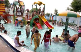 LEISURE TIME: People enjoying at a water park on the outskirts of Bathinda on Sunday. 