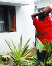 A Kashmiri Pandit smashes a window of the residence of Union minister of water resources Saifuddin Soz during a demonstration over the Amarnath land controversy in New Delhi on Sunday.
