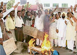 Activists of the All-India Safai Mazdoor Congress stage a dharna against Fatehgarh Sahib MLA in Ludhiana on Sunday.