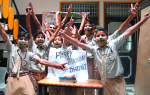 Students in Bathinda celebrating the birthday of Indian cricket skipper M.S. Dhoni on Monday. 