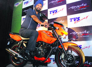 TVS Motor Companys marketing head , H.S. Goindi poses with TVS Apache RTR FI bike at its launch in New Delhi on Monday. The bike is priced at Rs 65,000.